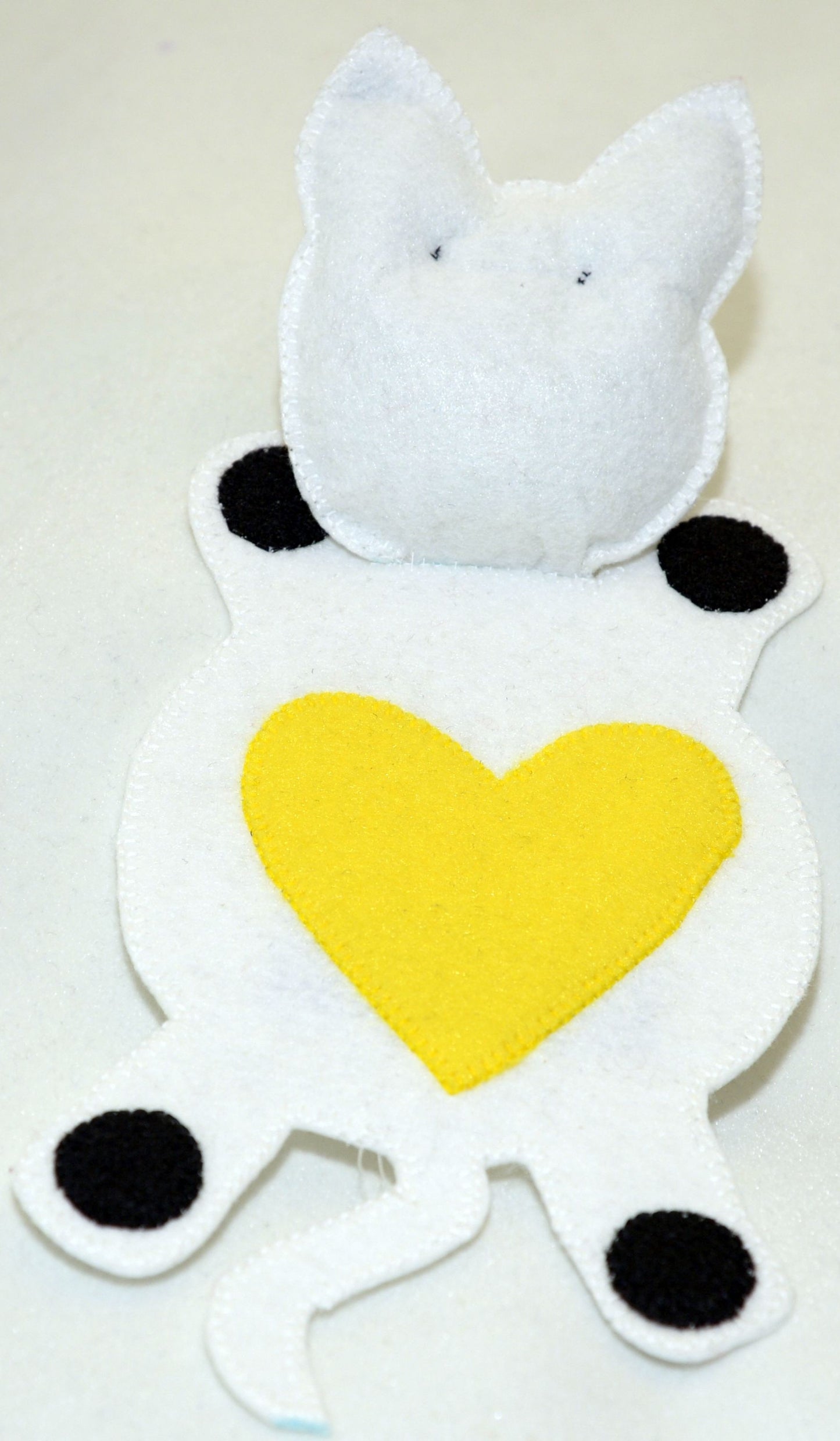 Mug Rug - White and black cat with yellow heart on back.