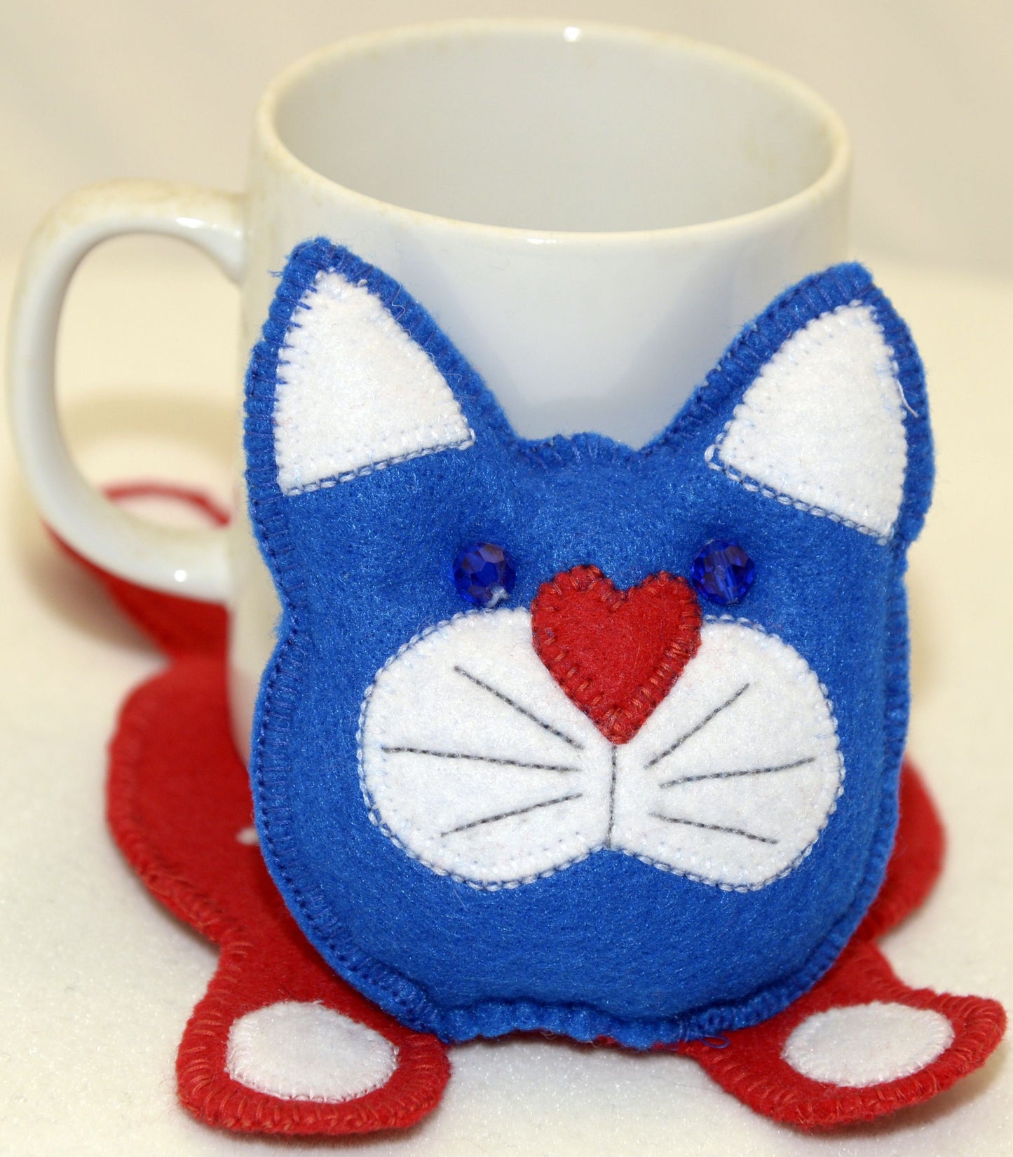 Mug Rug - Red, white and blue patriotic cat with a star on the back